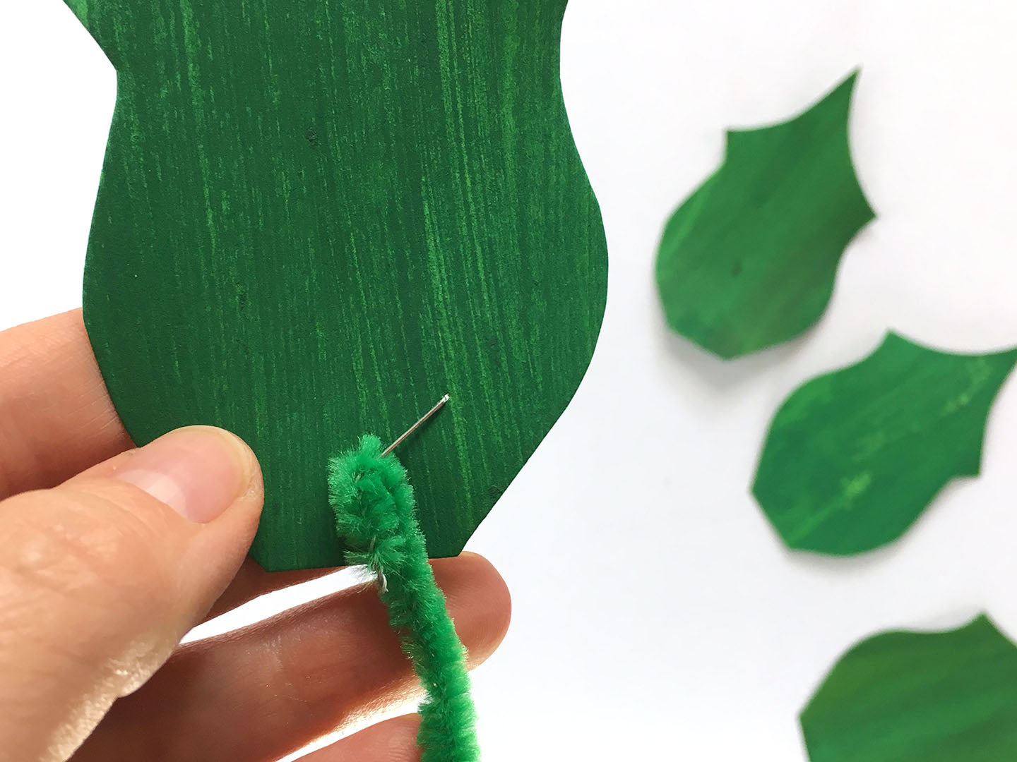 Poinsettia craft for kids staple leaves
